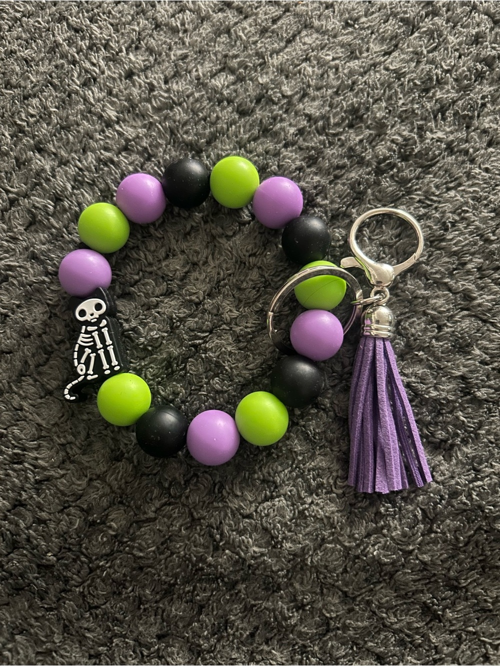 Handcrafted Beaded Wrist Keychain with Purple Tassel and Skeleton Charm